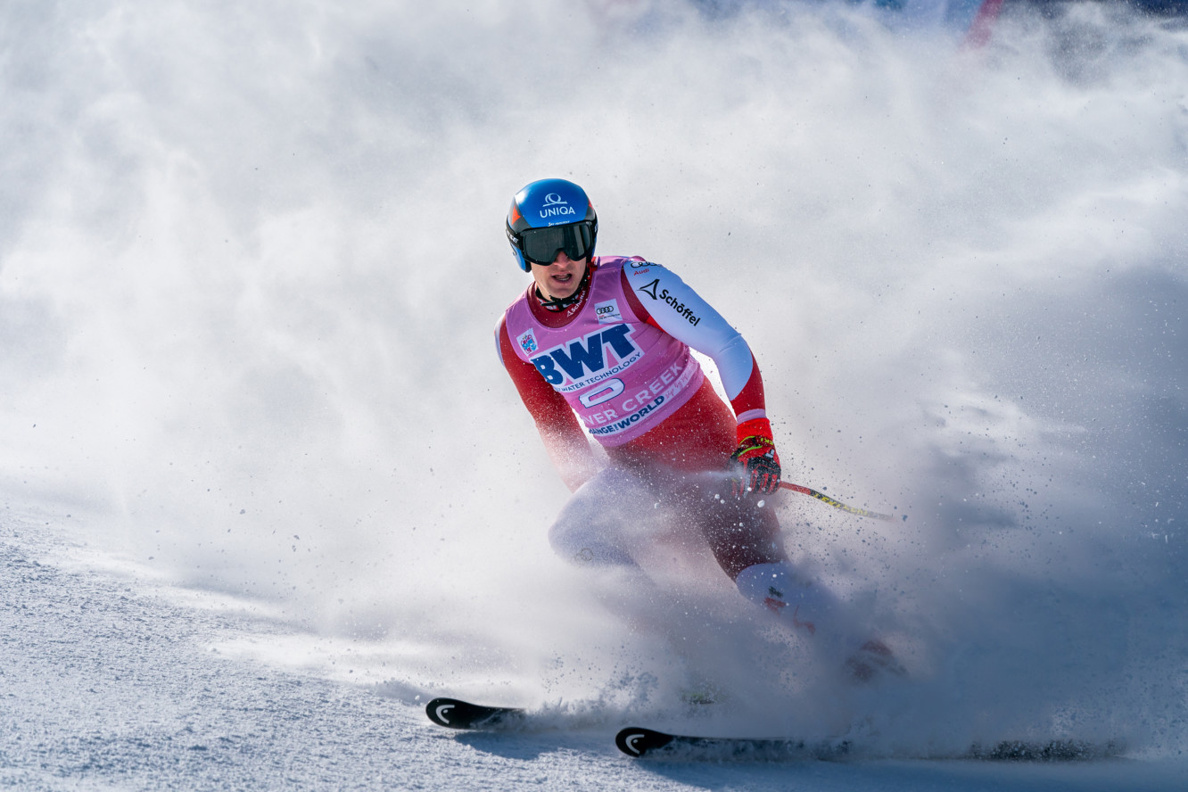 A World Cup ski racer carving through the snow on the Birds of Prey course at Beaver Creek